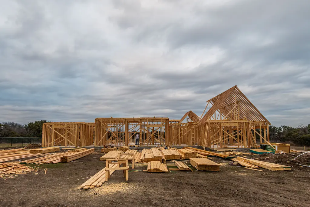 New timber framed house standing open on its foundation