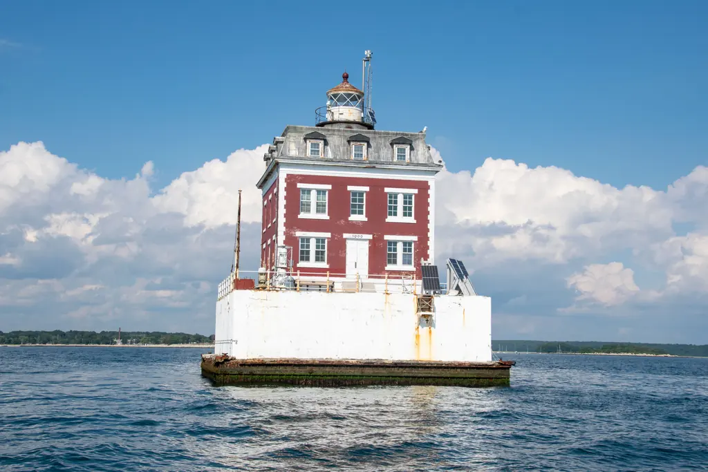 Lighthouse standing offshore in Long Island Sound