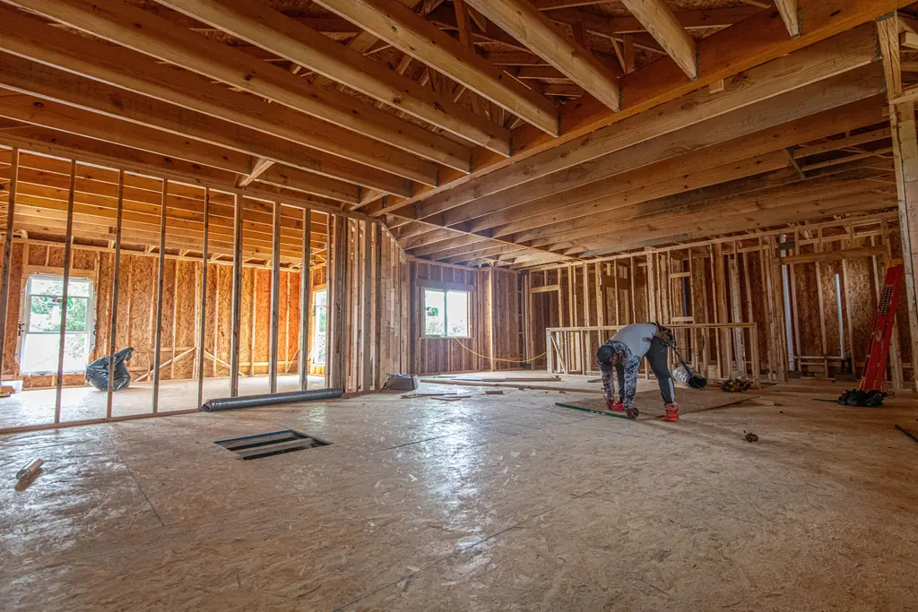 Interior of a house stripped back to studs during a structural renovation